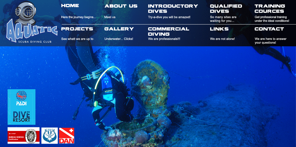 Diver looking closely to submarine interior